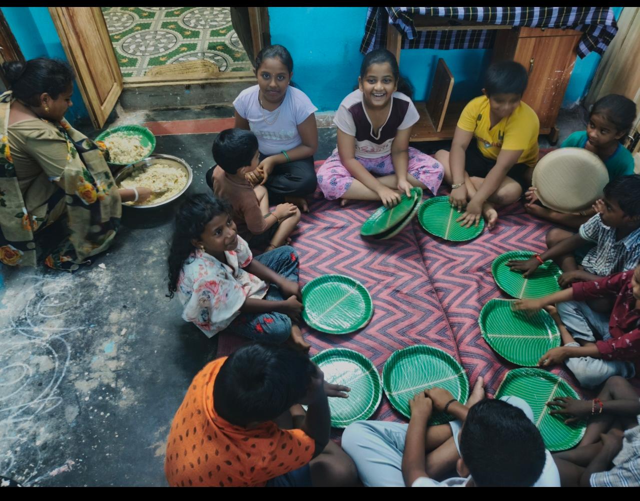 Children sharing a meal at the home in South India