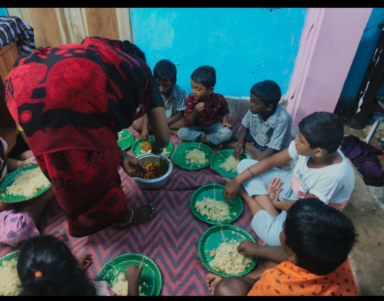 Children sharing a meal at the home in South India
